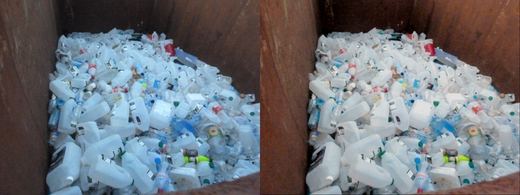 A large pile of empty plastic milk containers, two version with different colours