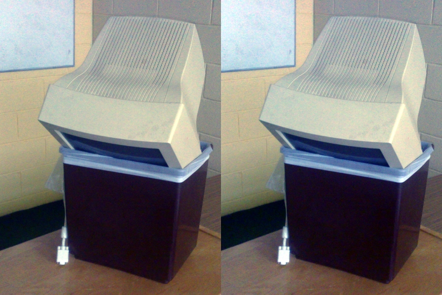 Two images of a computer in a bin, with slightly different colours