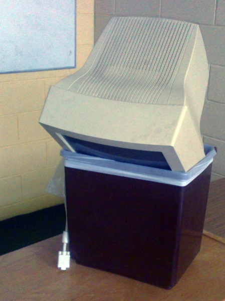 A computer monitor in a bin