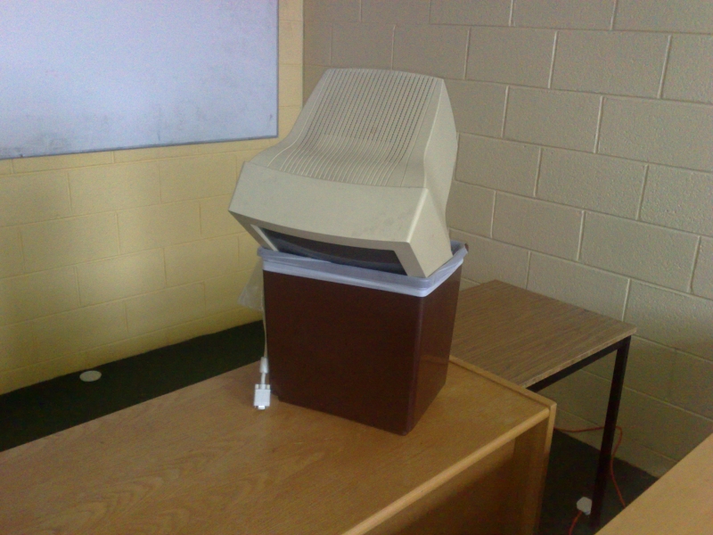 A computer monitor in a bin