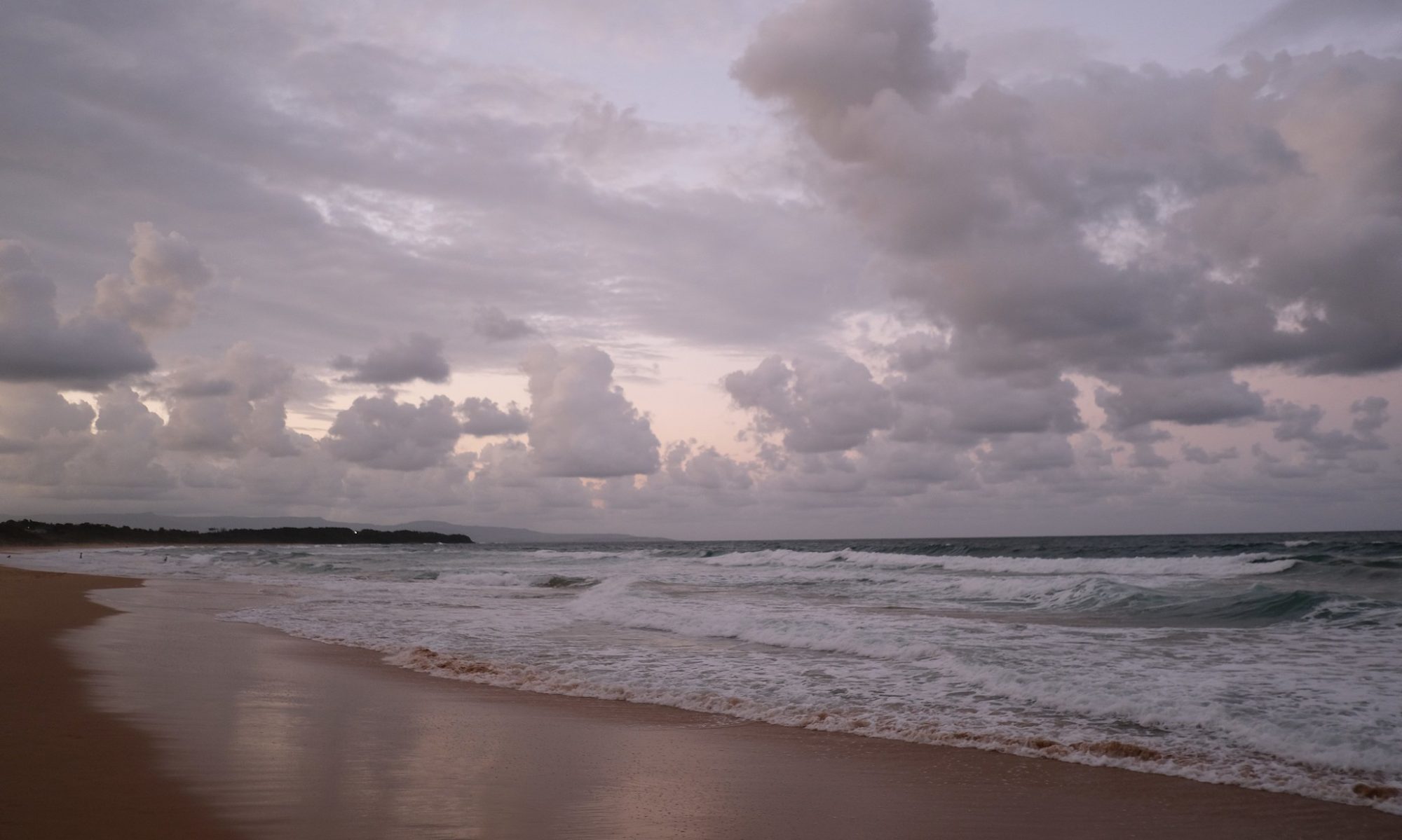 Clouds above a beach at dusk
